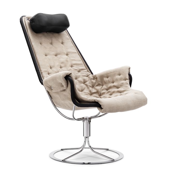 Jetson-fåtölj från DUX klädd i beige linne med detaljer i mörkt läder.