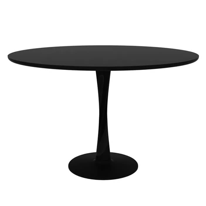 Torsion är ett runt matbord och även ett pelarbord från Ethnicraft tillverkat av svartbetsad ek med en klarlackad yta.